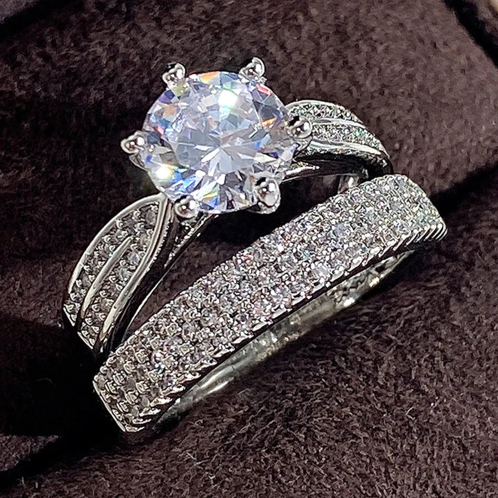 White gold colour wedding ring attached to matching bracelet with geometric shapes and round decorative elements