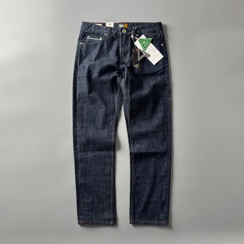 Men's primary colour straight leg denim jeans laid flat, showing mid waist and classic five-pocket design.