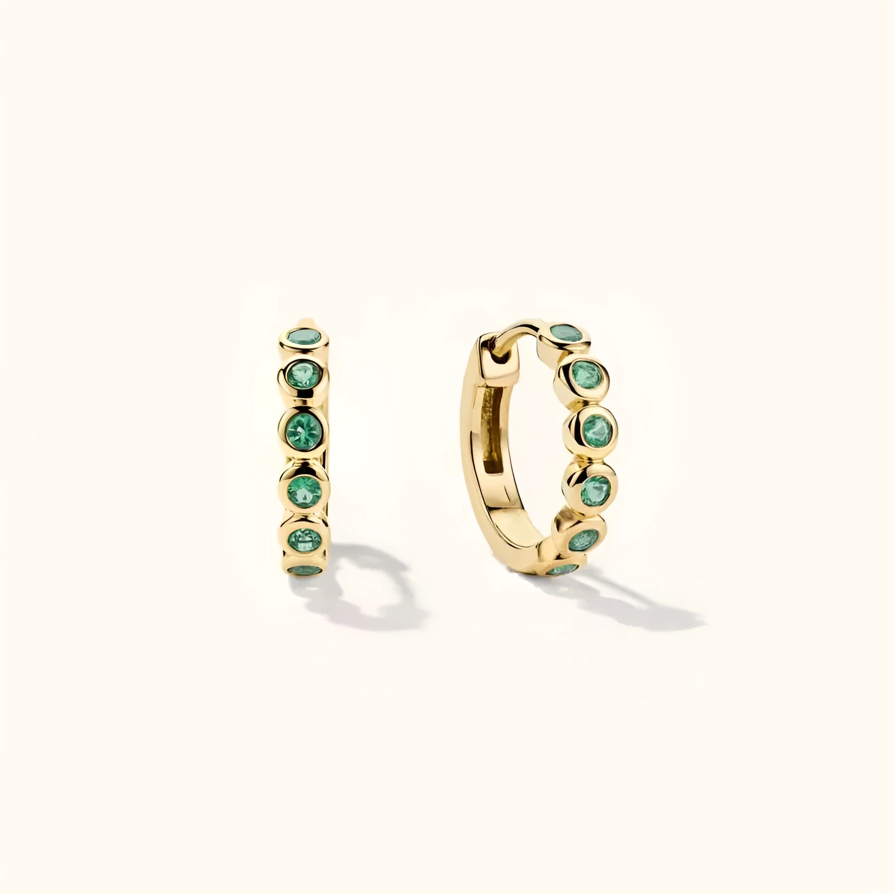 Gold S925 sterling silver geometric stud earrings with inlaid zircon on a white background