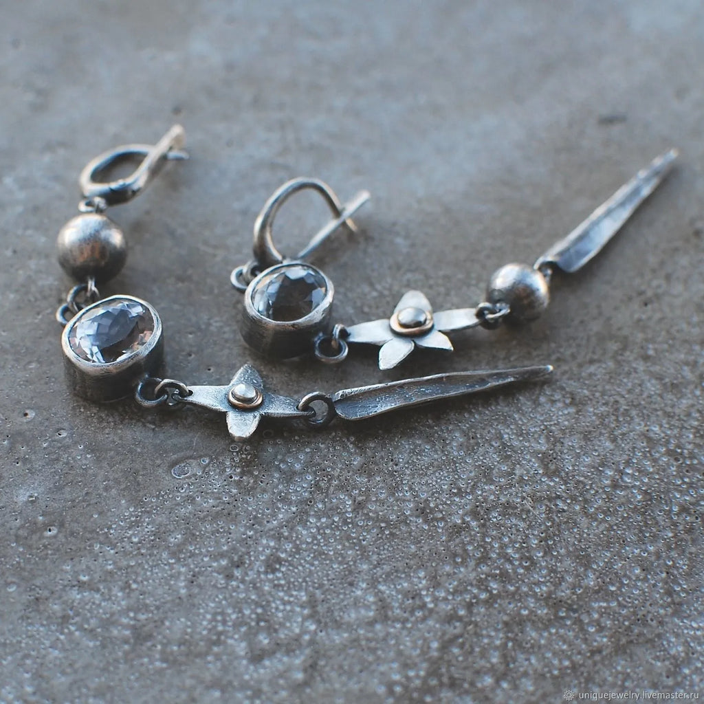 Geometric antique silver pendant earrings with XINGX design and rhinestone accents