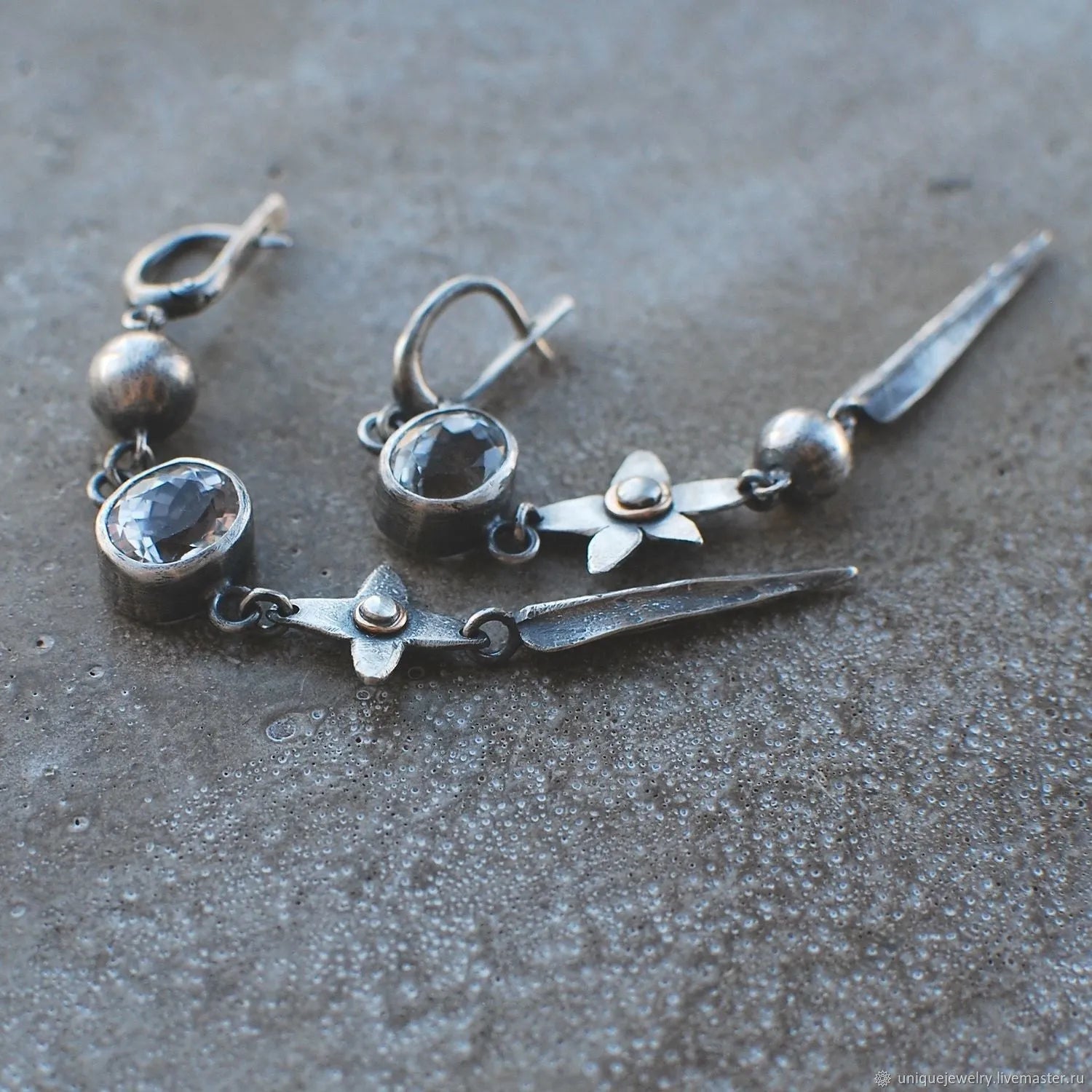 Geometric antique silver pendant earrings with XINGX design and rhinestone accents