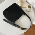 Women's soft PU shoulder bag with swing threads in black or brown colour options