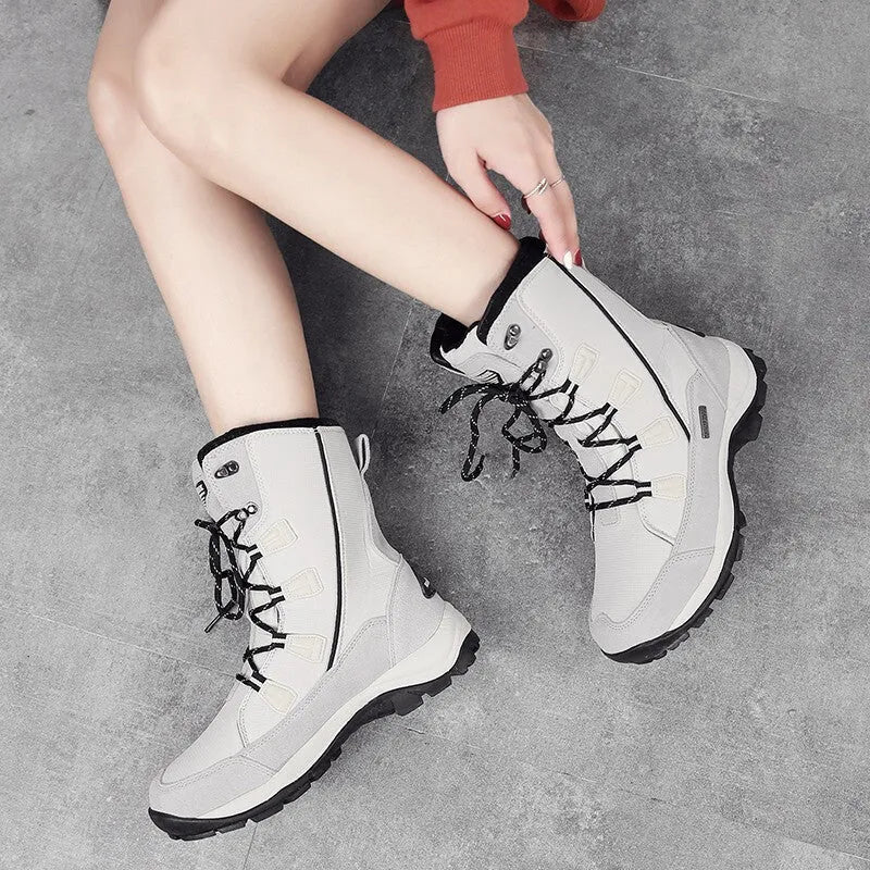 Women's genuine leather thermal snow boots in black colour with mid-calf length and round toe design