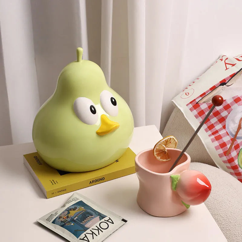 White ceramic pear shaped tissue box holder with cute animal design in green colour option