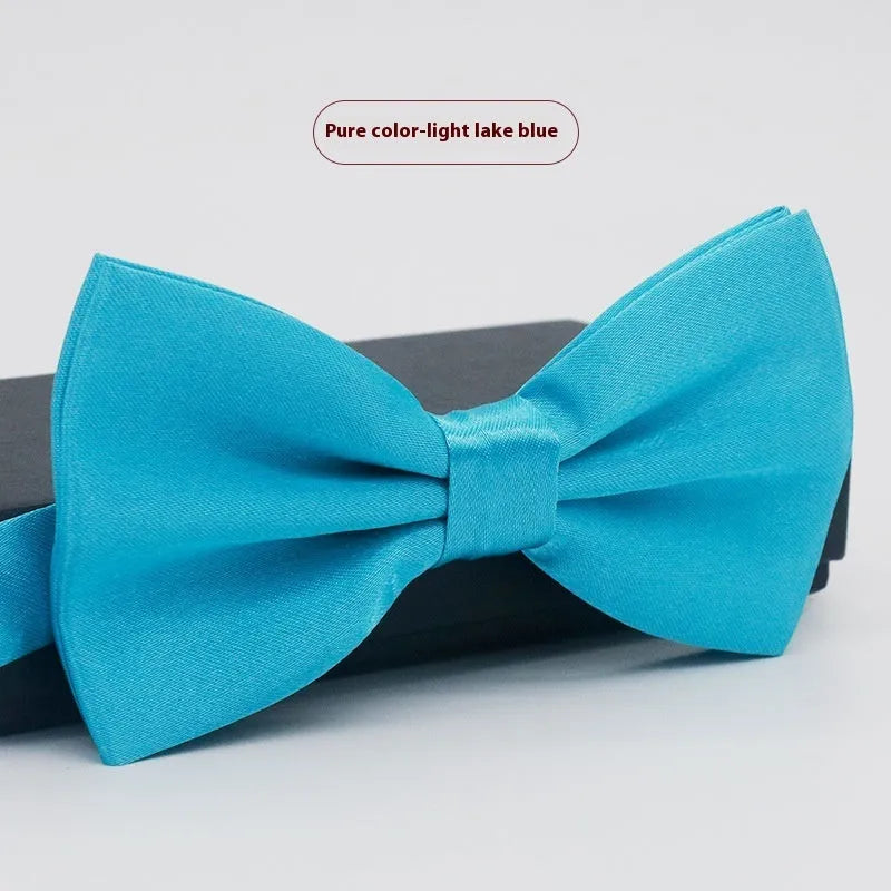 Solid colour flat head bow tie for formal wear in multiple colours including black, red, and blue.