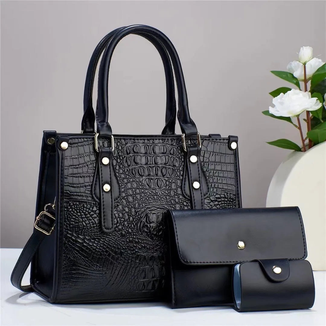 PU leather three-piece bag set showing bucket crossbody bag, wallet and card holder with contrast trim in burgundy colour