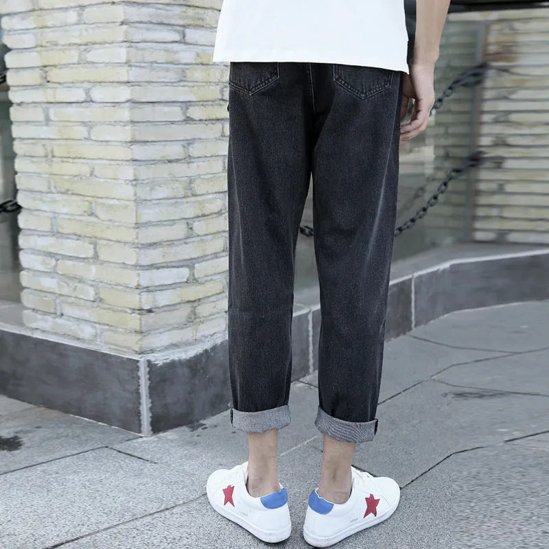 Men's straight-leg harem jeans in black or blue cotton fabric showing loose fit design