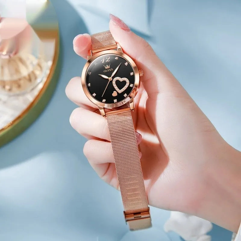Women's rose shell case fashion watch with mesh strap, showing multiple dial colour options.