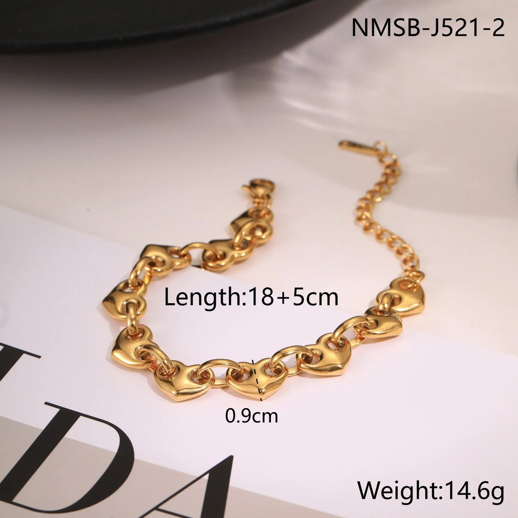 Stainless steel women's bracelet with a hollowed-out heart charm in gold or steel colour.