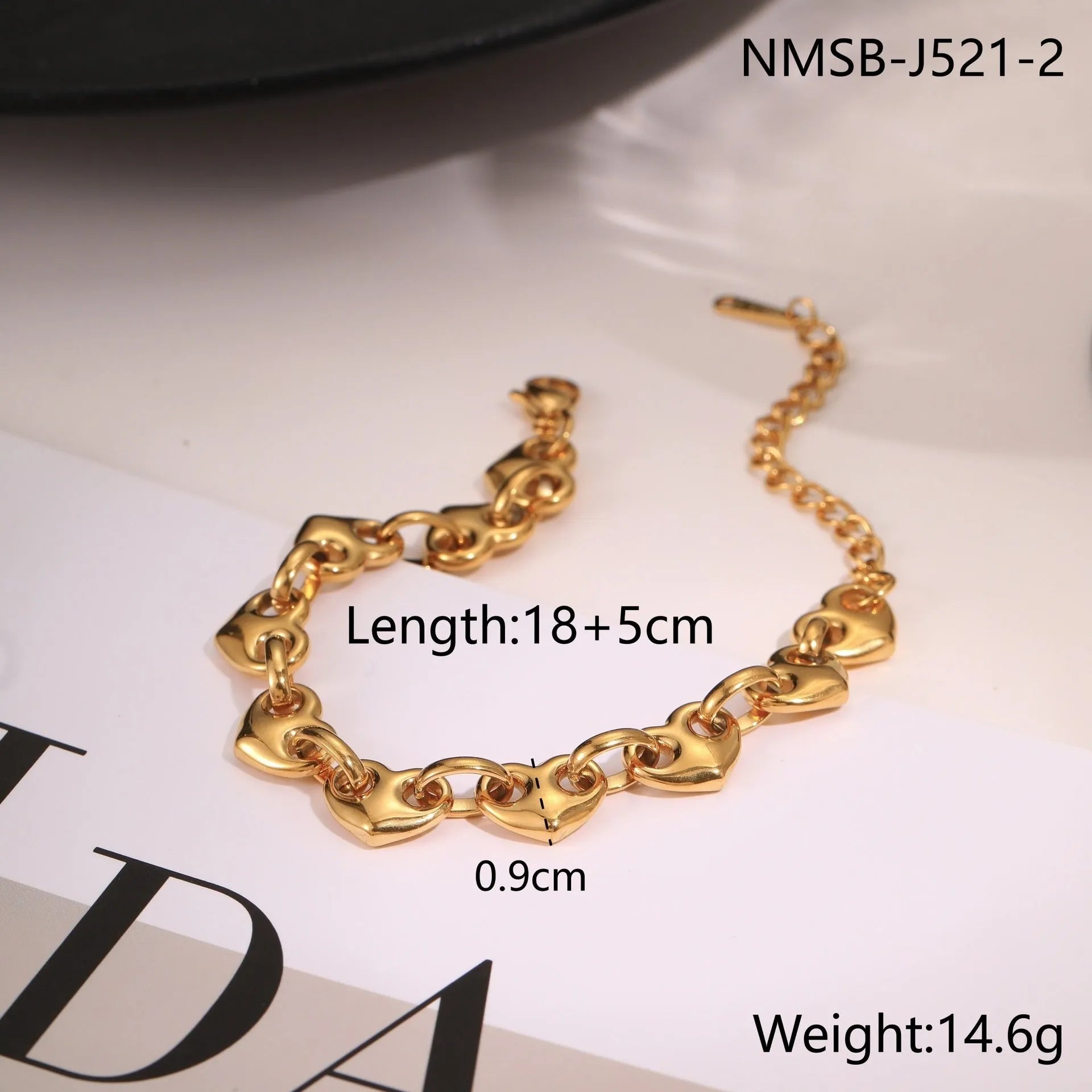 Stainless steel women's bracelet with a hollowed-out heart charm in gold or steel colour.