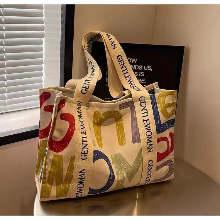 Large capacity cotton canvas tote bag with printed design options including black letter, coloured letter and pattern styles