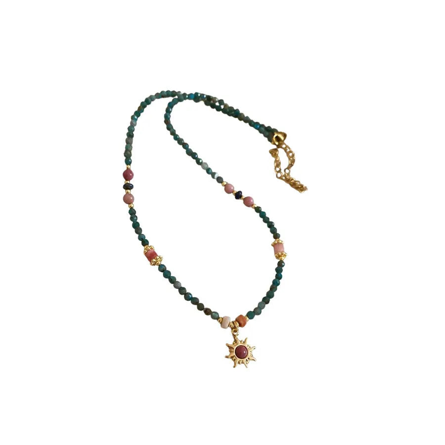 Freshwater pearl sun necklace on clavicle chain in court style, blue-sun colour option.