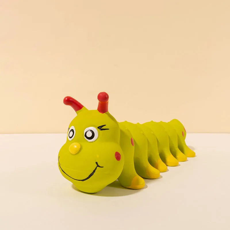 Yellow caterpillar-shaped rubber dog squeaky chew toy on a white background.