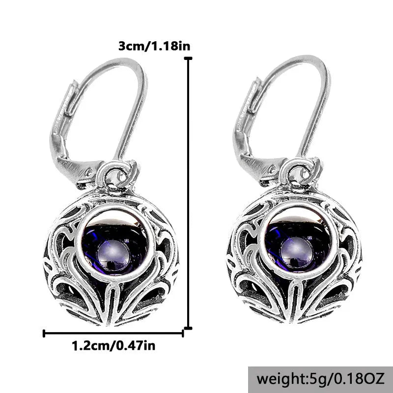Silver geometric vintage engraving hollow drop earrings with blue gemstone centre