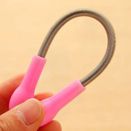 Pink manual spring facial hair removal device for face and lip hair, PP plastic, 19cm length