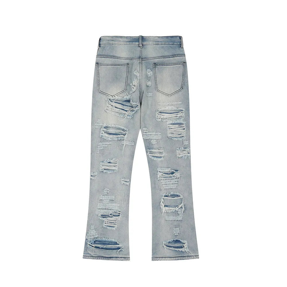 Men's light blue flared washed denim jeans with zipper fly on a model