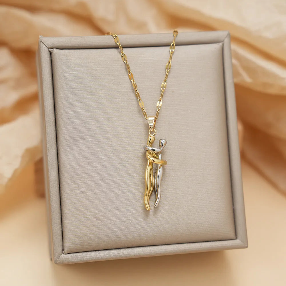 Couple hugging bronze pendant necklace on unisex stainless steel chain with gold lip chain finish, casual style