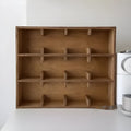 Solid birch wood cup storage rack with multiple grid compartments in meridian colour