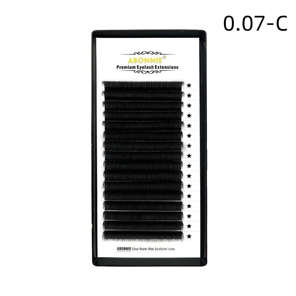 Pair of dense 16-row false eyelashes made from matte wool mink hair, showing voluminous length.