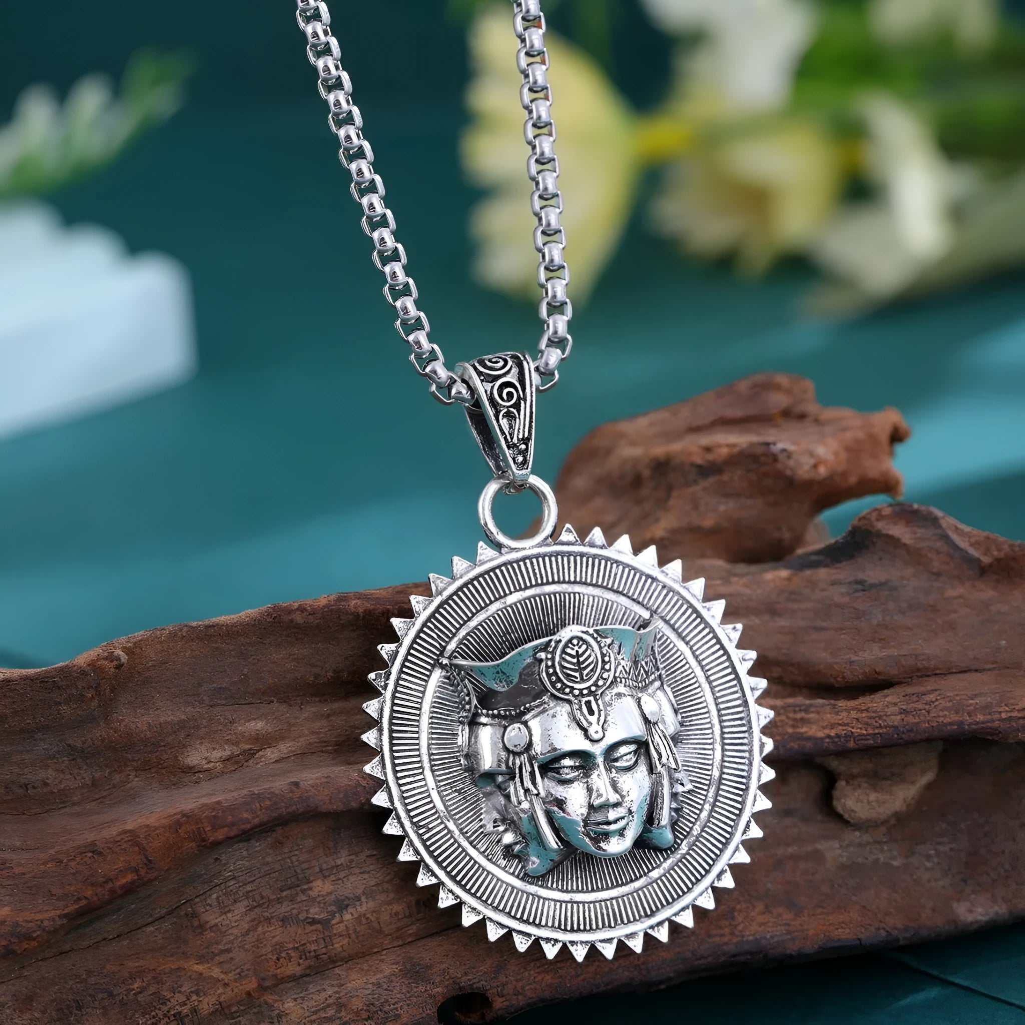 Head pendant sweater chain necklace for men in silver colour with heavy link chain on neutral background