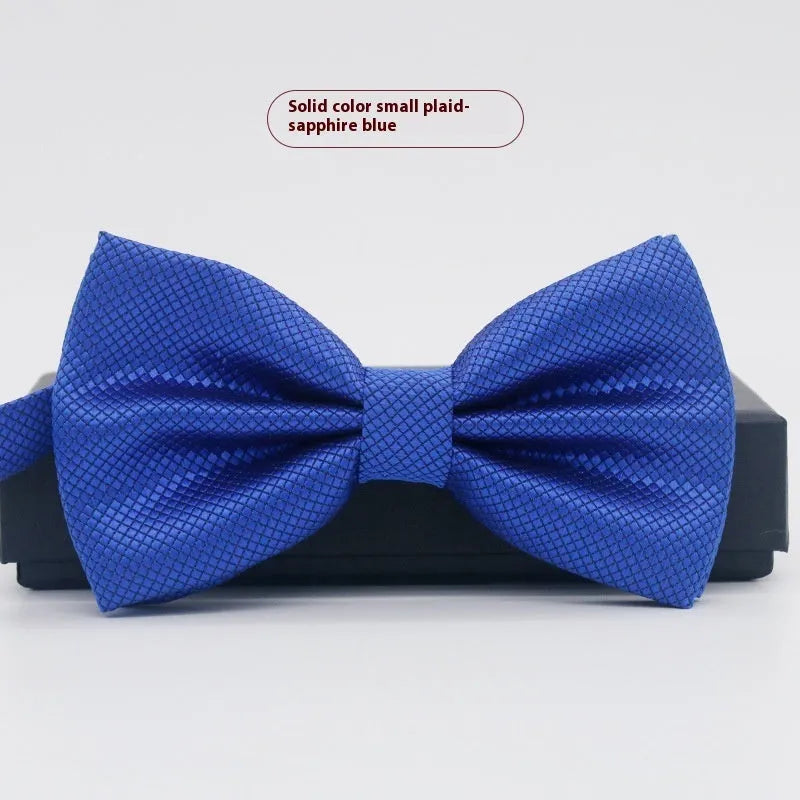 Solid colour flat head bow tie for formal wear in multiple colours including black, red, and blue.