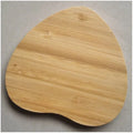 Square wooden bamboo 5W Qi wireless charging pad for smartphones on a table.