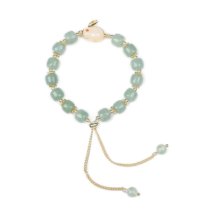 Green aventurine and strawberry quartz rabbit charm bracelet for women with copper and gold details
