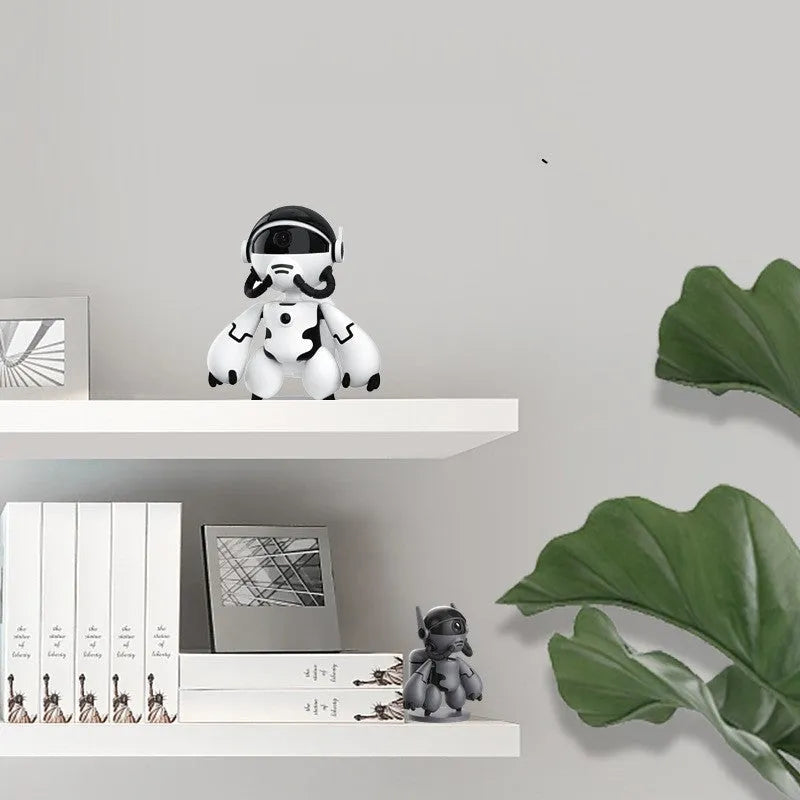 White or black Space Robot home monitoring camera on a detachable base with anti-slip pads.