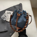 Blue cross body bucket messenger bag with synthetic leather lining and sandwich pocket organisation