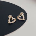 Micro-set zircon asymmetric heart earrings for women, copper base, white colour, ear clip style