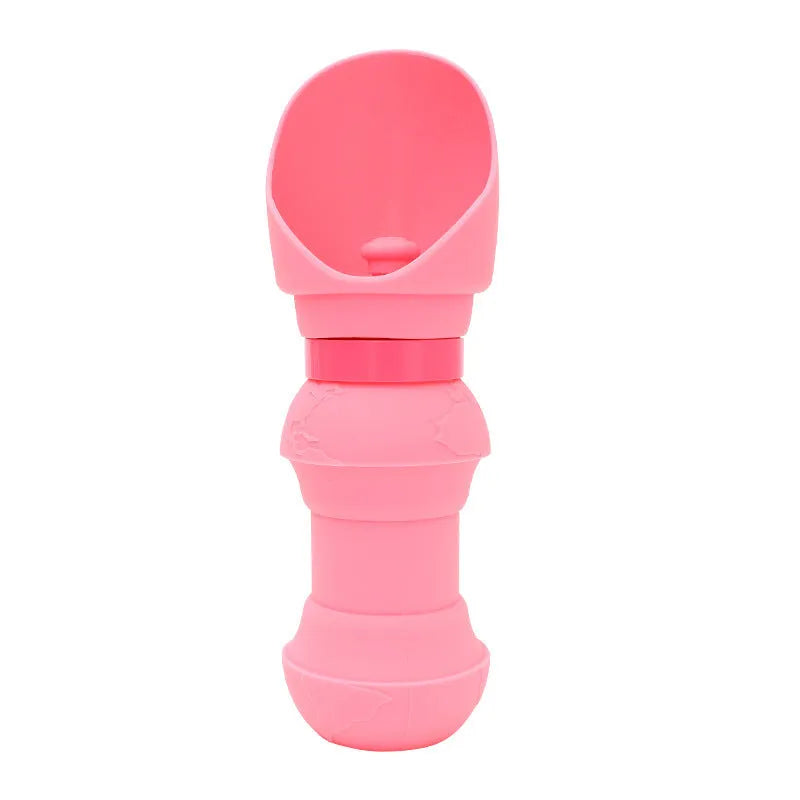 A folded flat and an unfolded pink silicone pet water bowl showing its collapsible design for portable use.