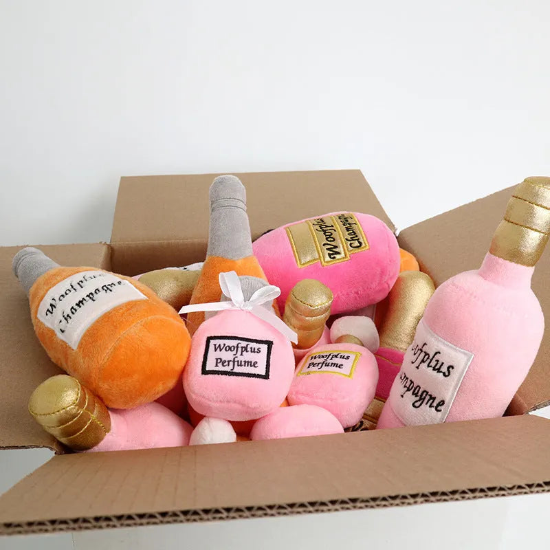 Plush wine bottle pet toy in assorted colours including green, orange, red, black and white.