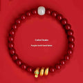 Handmade red cinnabar bracelet with snake zodiac beads, shown in 6mm and 8mm size options.
