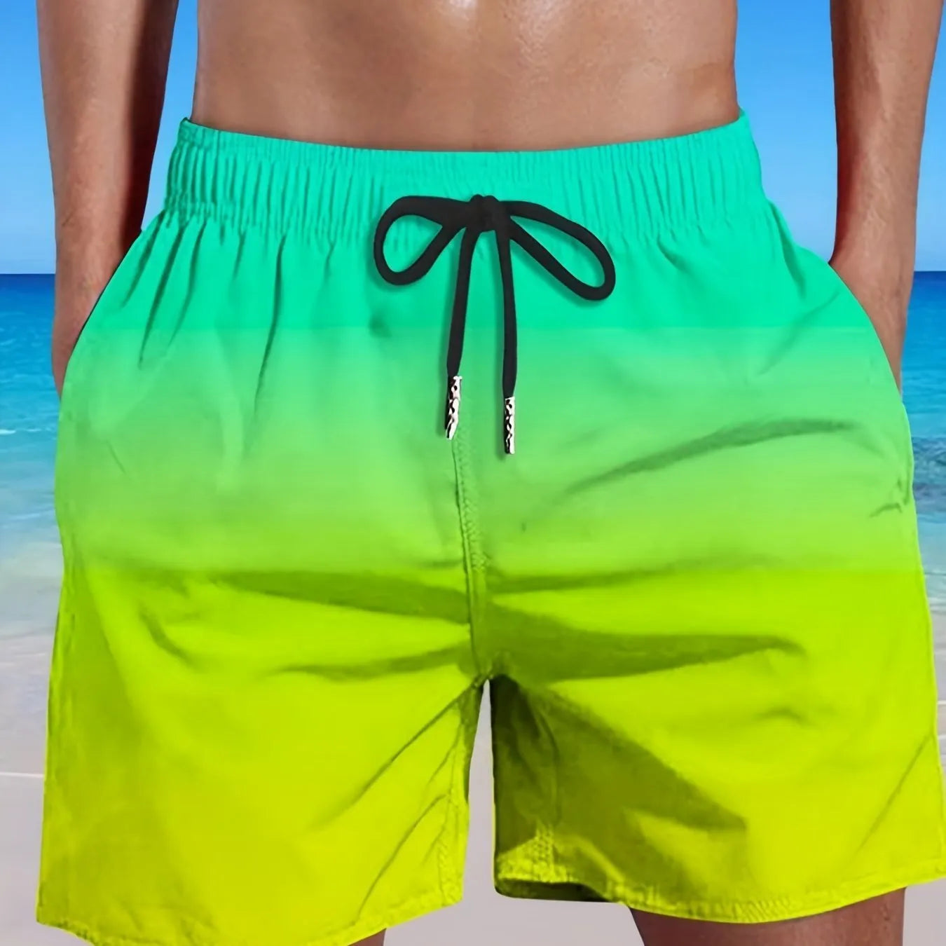 Man wearing grey gradient 3D printed mesh sports shorts against a plain background.