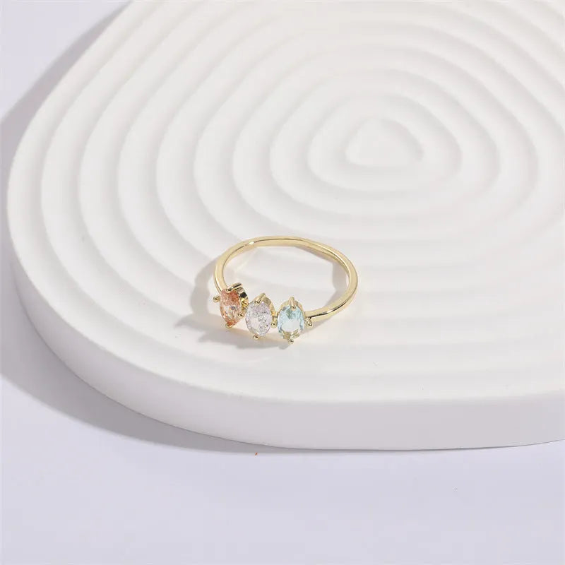 Geometric triangle design women's ring with horse eye motifs and tricolor zircon stones in 14k gold colour