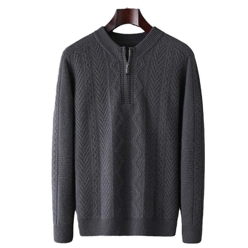 Men's grey wool half zip sweater with a diamond lattice pattern, shown on a model.