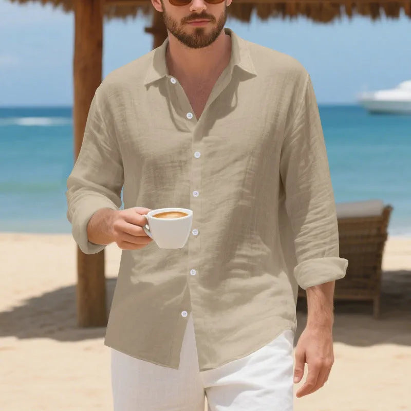 Men's loose fit linen Hawaiian casual shirt on a hanger, shown in light blue colour.