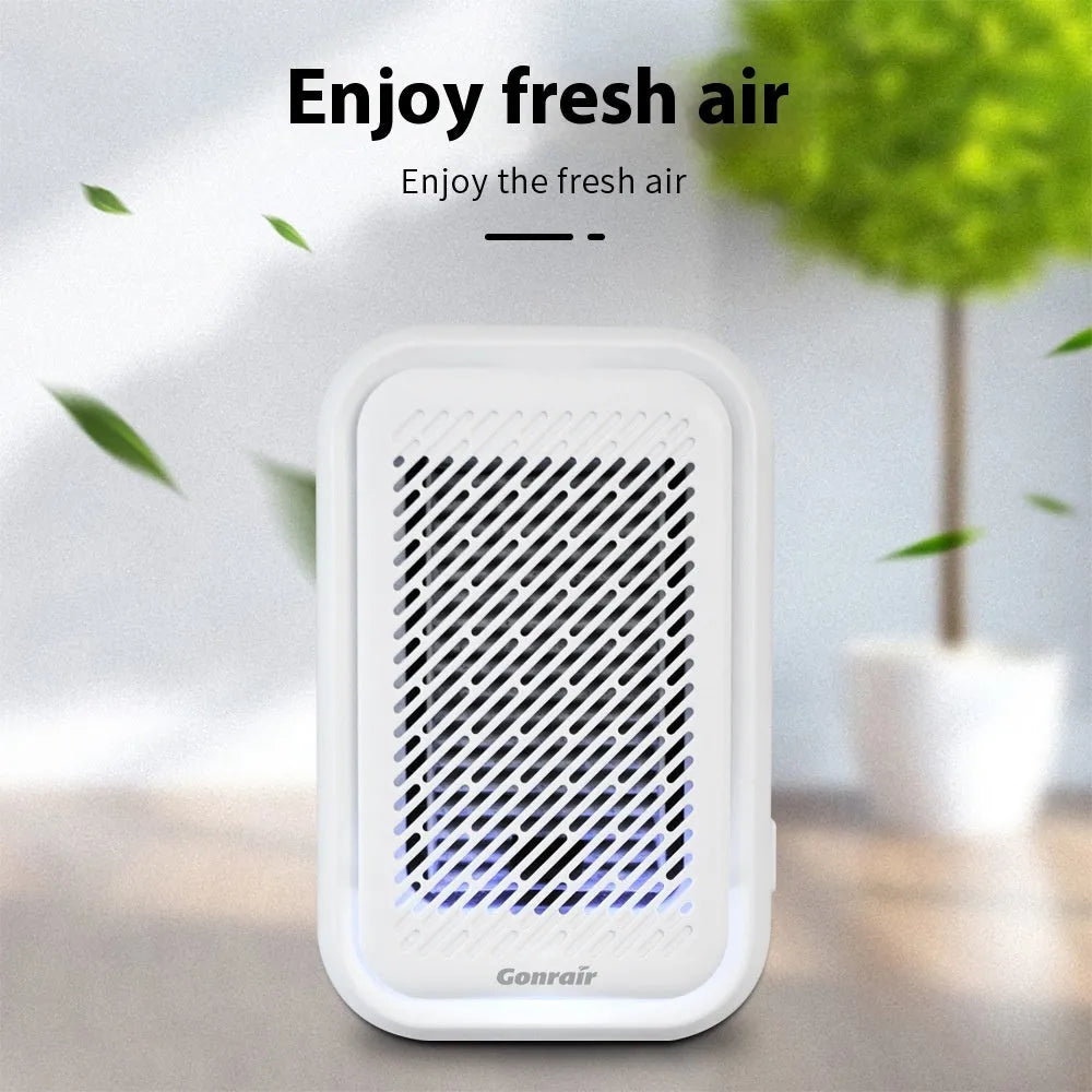 White wall-mounted direct plug-in air purifier unit for small rooms.
