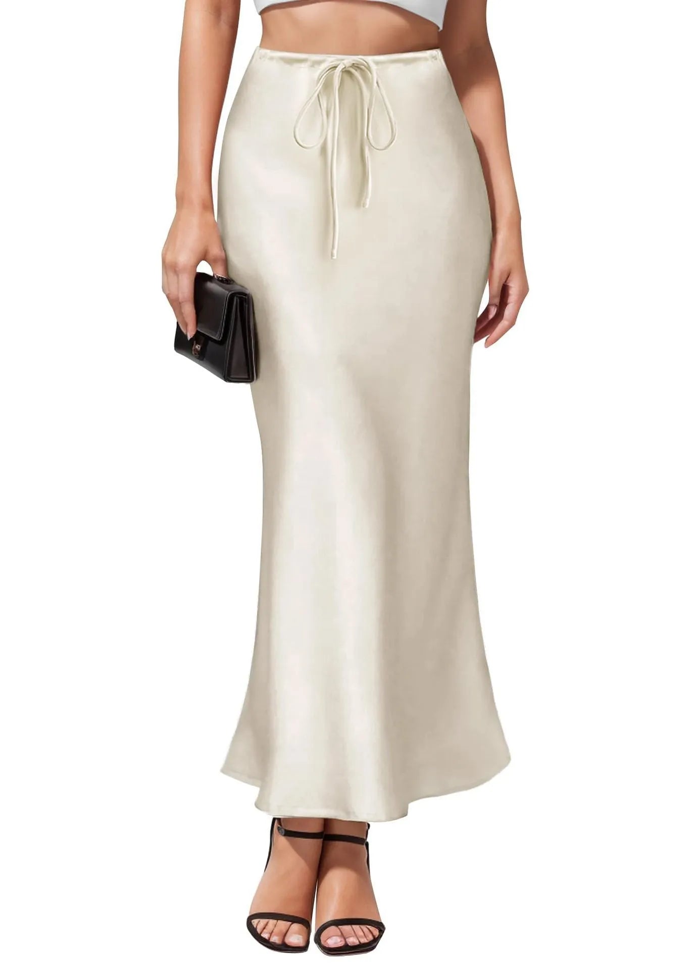 Women's asymmetric acetate satin skirt in a solid colour with high waist and irregular stitching detail.