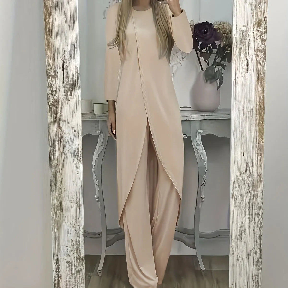 Casual black polyester two-piece lounge set with long sleeve top and loose trousers on a hanger.