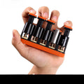 Grey and orange silicone finger exercise tool for musicians and climbers.