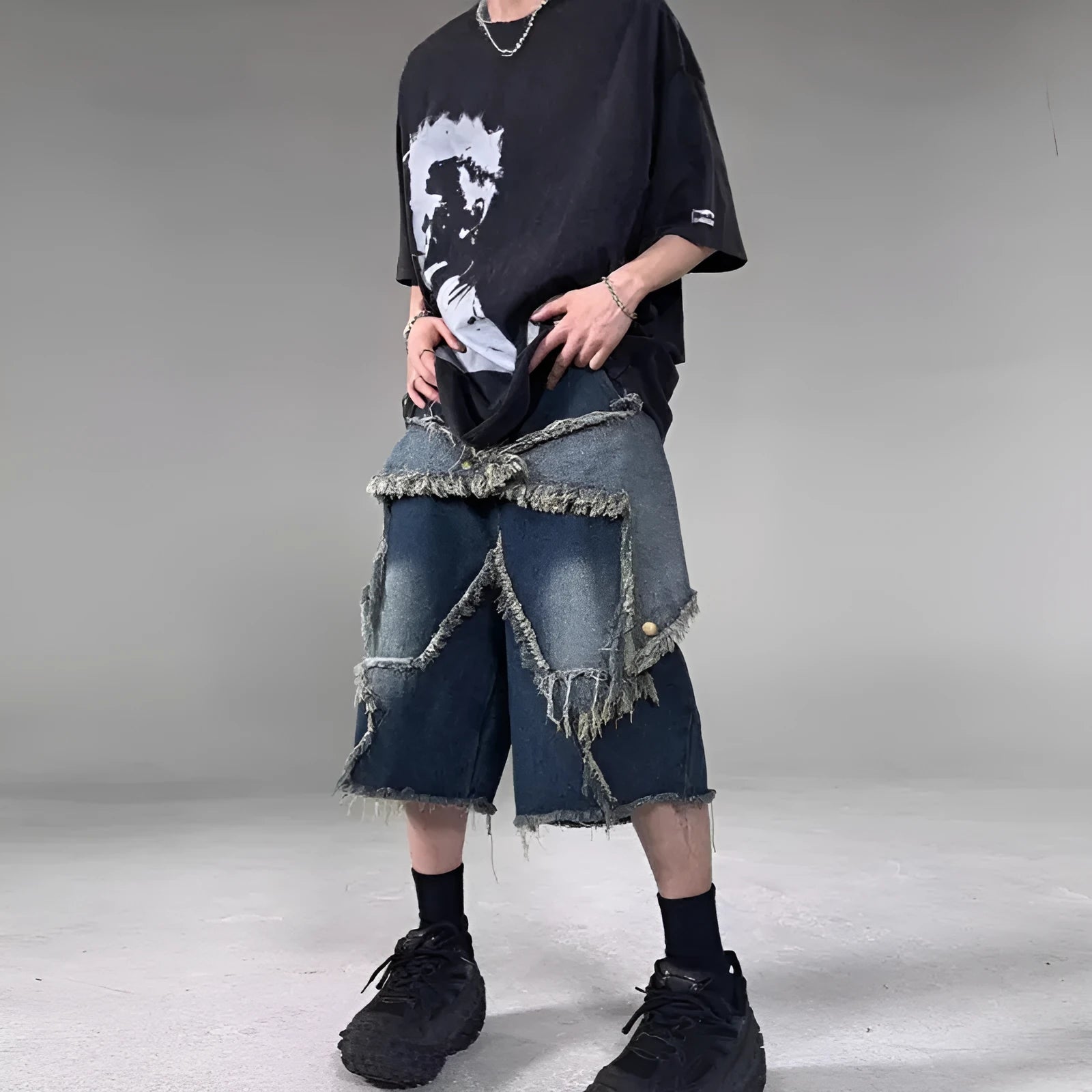 Blue denim shorts with frayed five-pointed star decoration in loose retro style