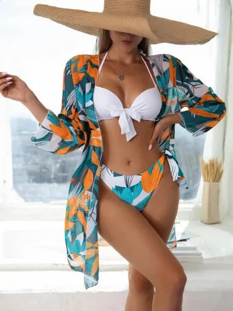 Women's three-piece bikini swimsuit set with mesh split detail in a quick-dry fabric.