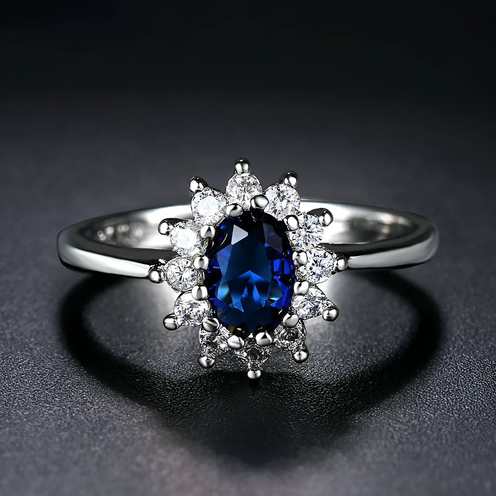Copper flower-shaped women's ring with zirconium inlay, shown in green, blue, or red electroplated finish.