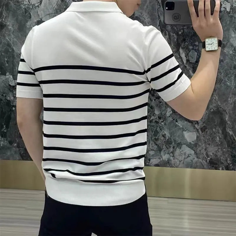 Man wearing a black and white striped knitted T-shirt with a lapel collar, casual style.