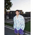 Blue floral long sleeve shirt with embossed three-dimensional pattern in loose fit chemical fibre blend fabric