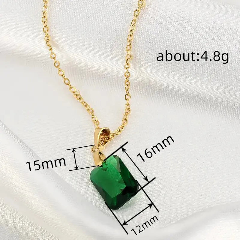 Copper geometric necklace with rectangular green pendant on an O-ring chain.