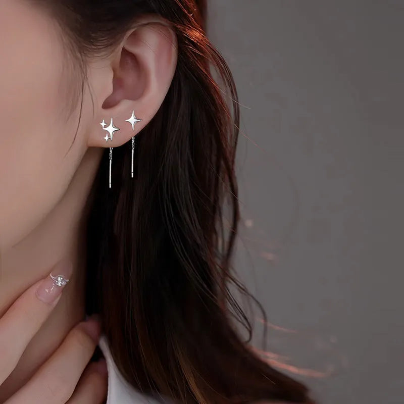 Asymmetric four eight-pointed stars hanging earrings in copper for women