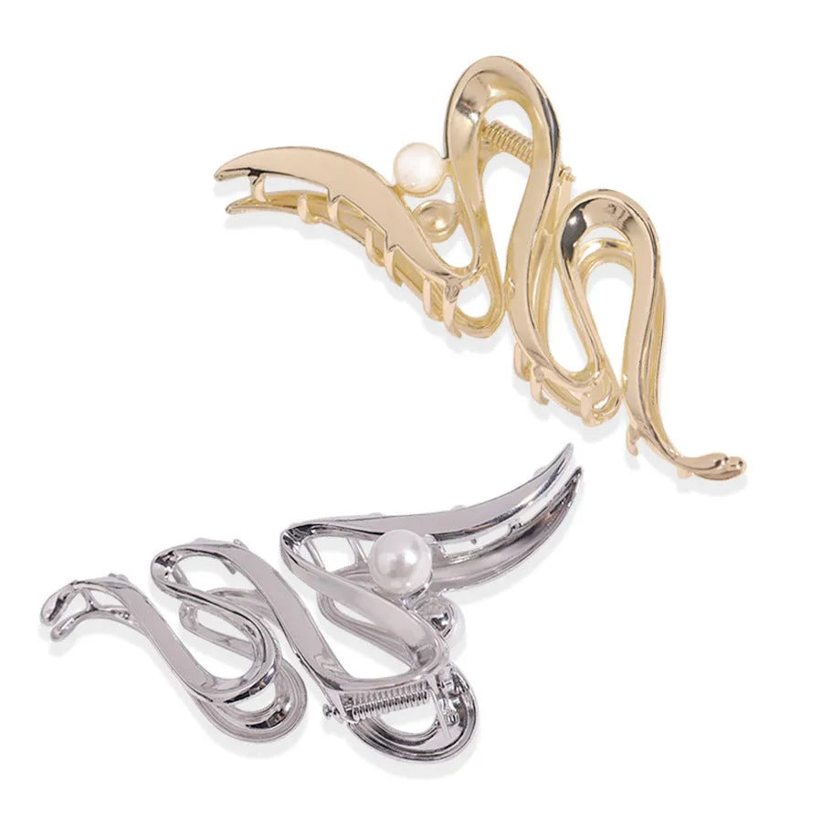 Assorted silver metal hair claws and barrettes including wave, knot, bow, and pearl designs on a white background.