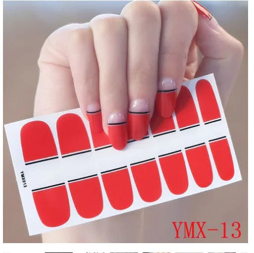 Full nail stickers set of 14 sheets showing 16 colour options in a flat lay arrangement